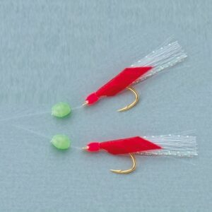 Chicharrera de pesca piel roja con anzuelos dorados y flecos brillantes para spinning y pesca vertical